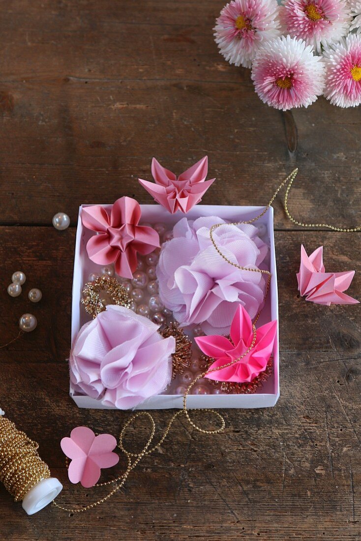 Pink origami flowers and lilac fabric flowers