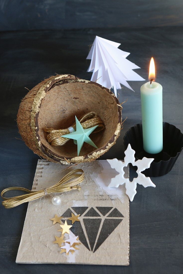 Festive still-life arrangement of lit candle and coconut