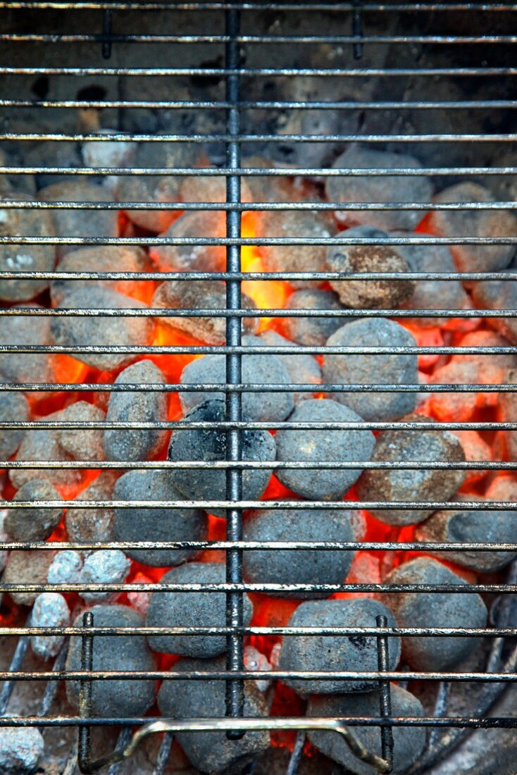 Glowing hot charcoal briquettes