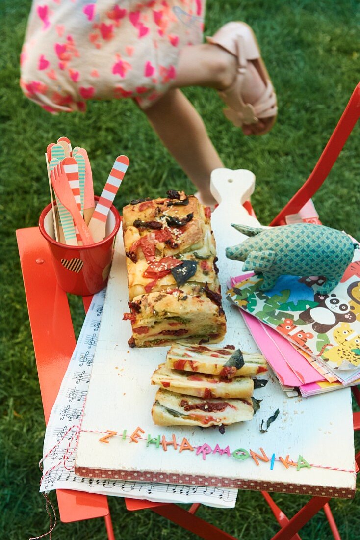 Accordion shaped pizza bread for a children's party in the garden