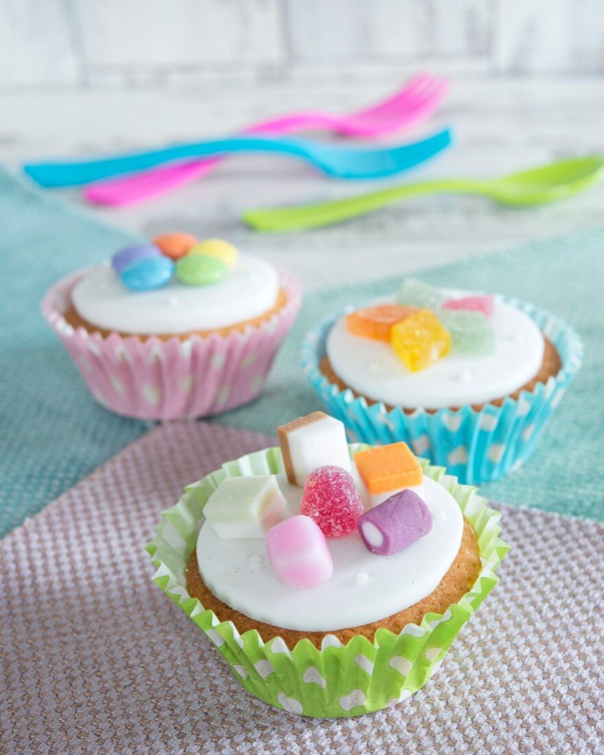 Cupcakes topped with colourful candies