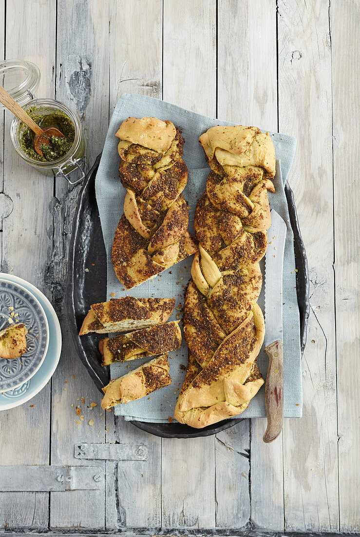 Yeast dough plaits with wild herb pesto and pine nuts