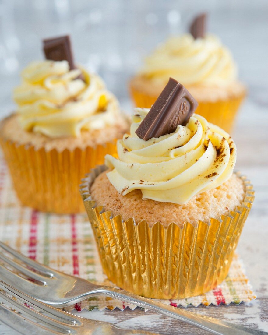 Cupcakes with buttercream and a piece of chocolate on the top