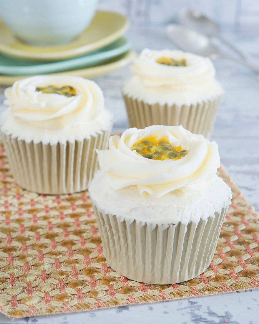Cupcakes with buttercream and passion fruit sauce
