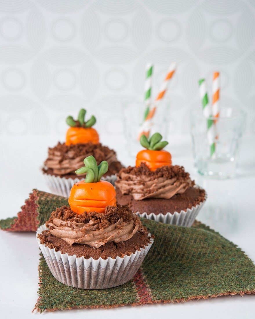 Chocolate cupcakes with marzipan pumpkins
