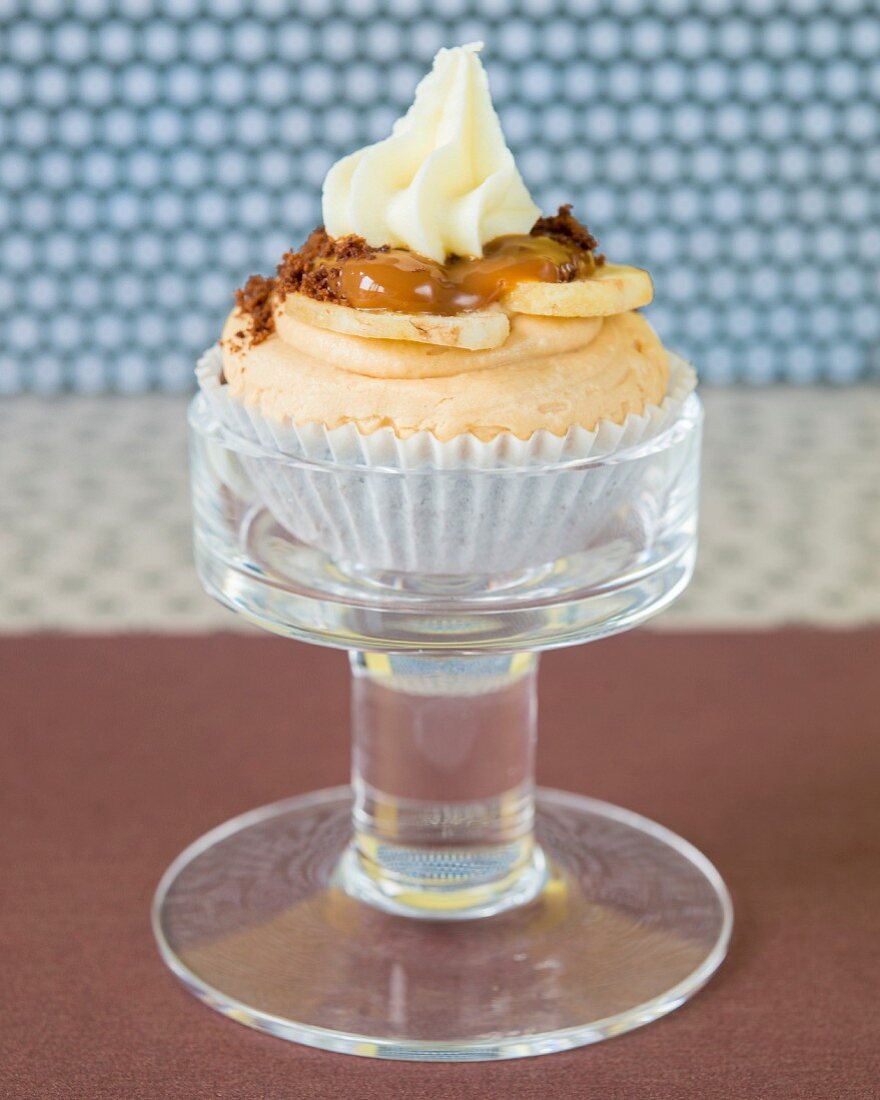 A banoffee cupcake with banana and caramel