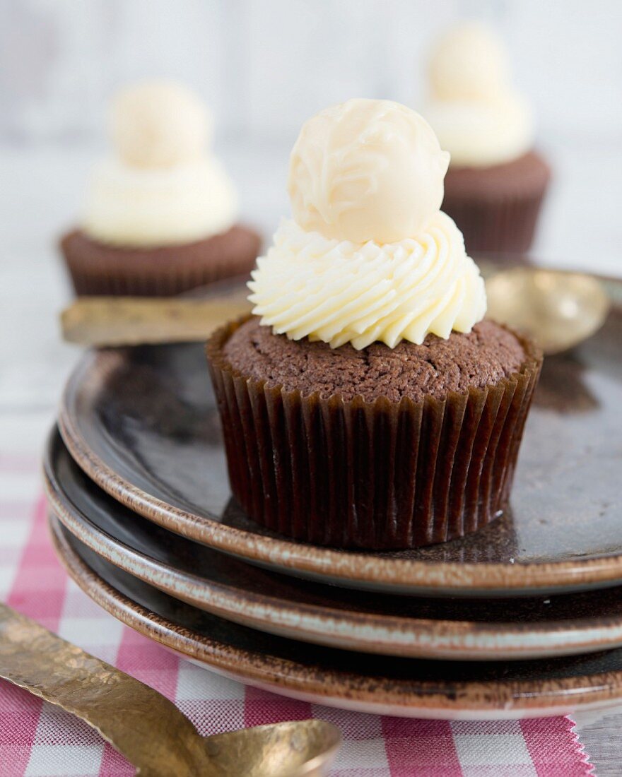 Chocolate cupcakes with a white chocolate praline on the top