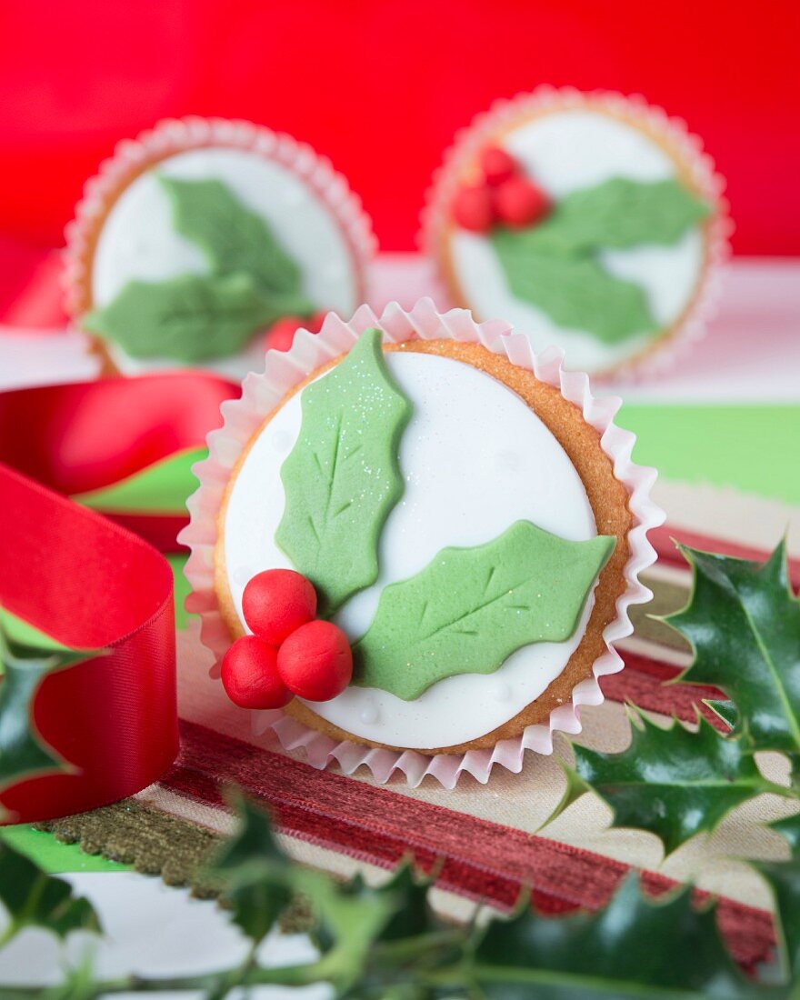 Christmas cupcakes with holly icing