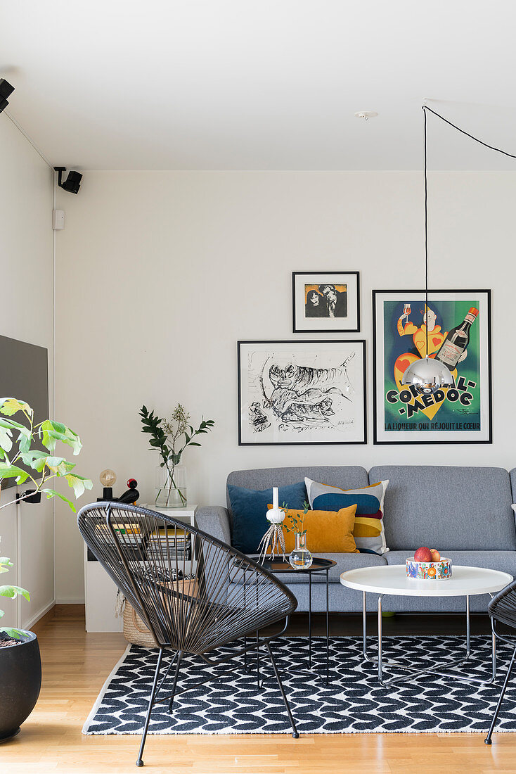 Classic chair, coffee table and grey sofa in living room