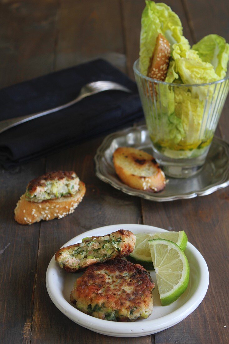 Courgette and salmon fritters with sesame seed bread and salad