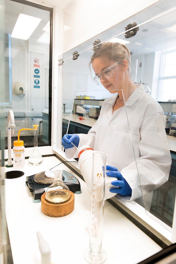 Chemistry student using fume cupboard