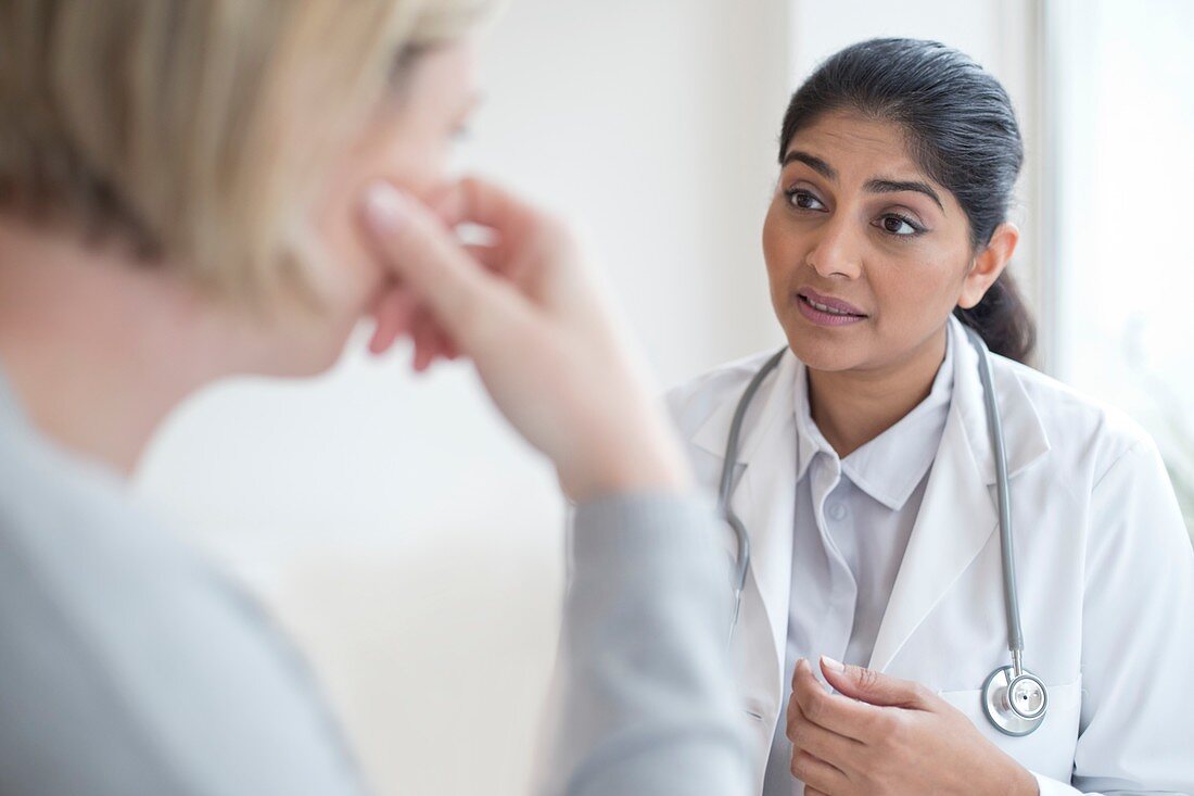 Female doctor talking to patient