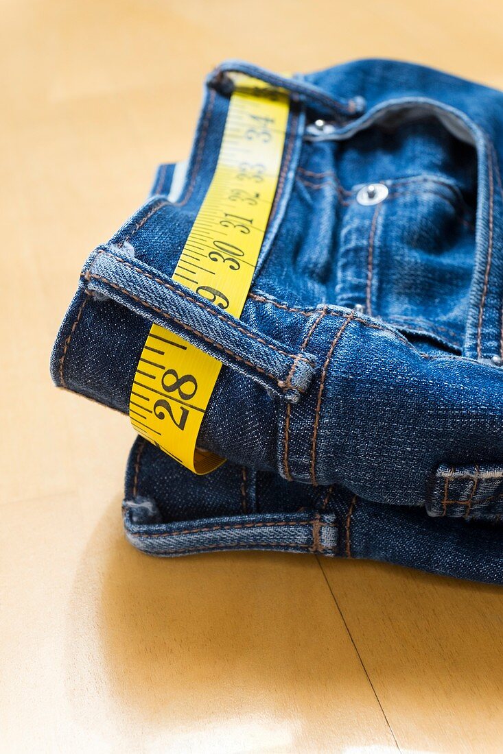 A pair of jeans and tape measure