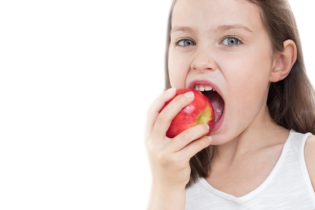 Girl biting apple