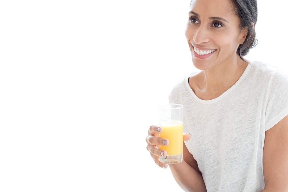 Woman with glass of orange juice