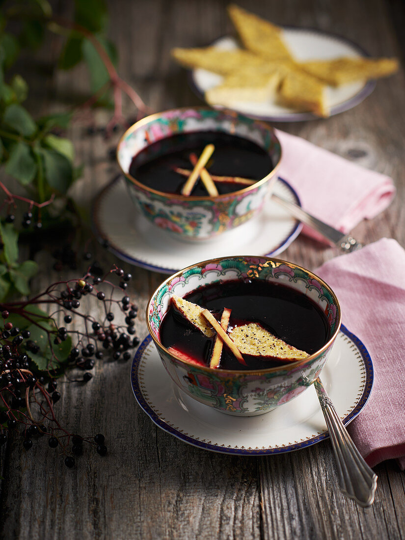 Elderberry soup with poppy seed and polenta biscuits