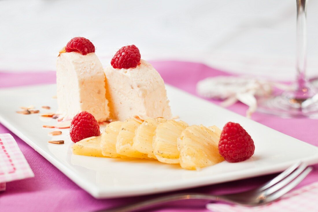 Almond parfait with pineapple and raspberries