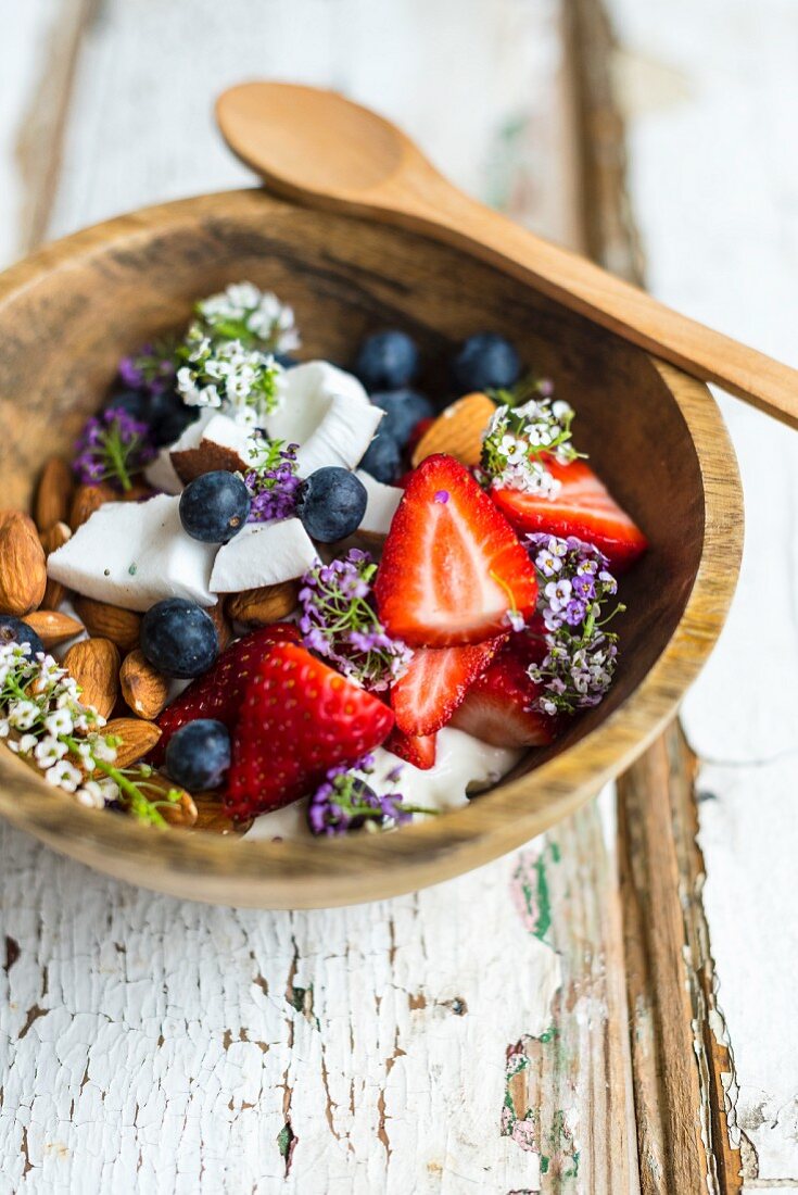 Yoghurt, muesli, coconut and almonds for breakfast