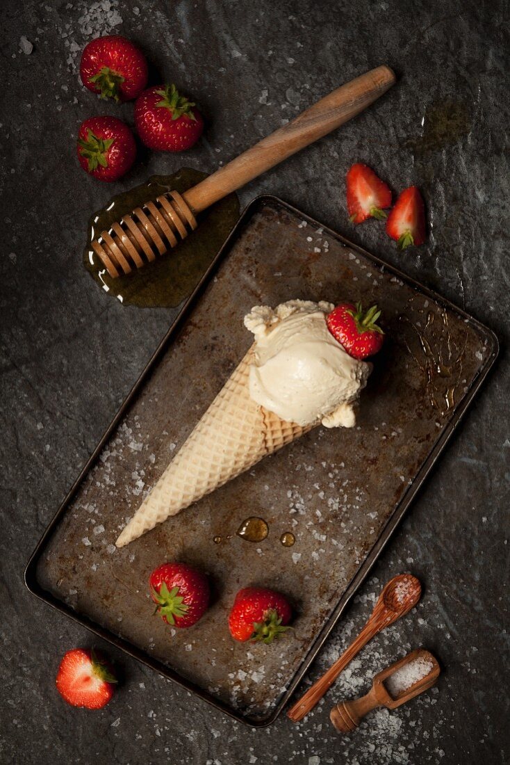 Salted Honey Ice Cream in cone with strawberries