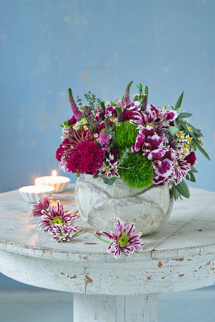 Purple and green bouquet of orchids, chrysanthemums and speedwell