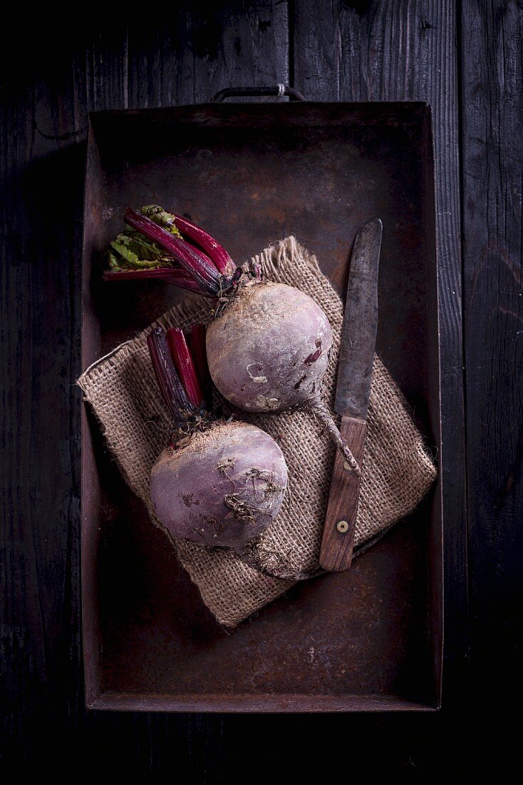 Beetroot on a metal tray with a knife