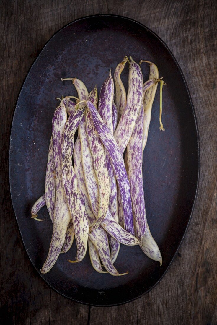 White borlotti beans on a dark background