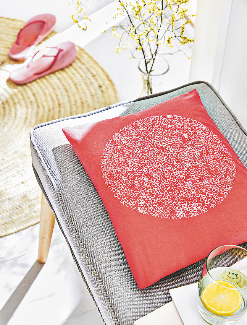 A homemade cushion cover with a stamped pattern