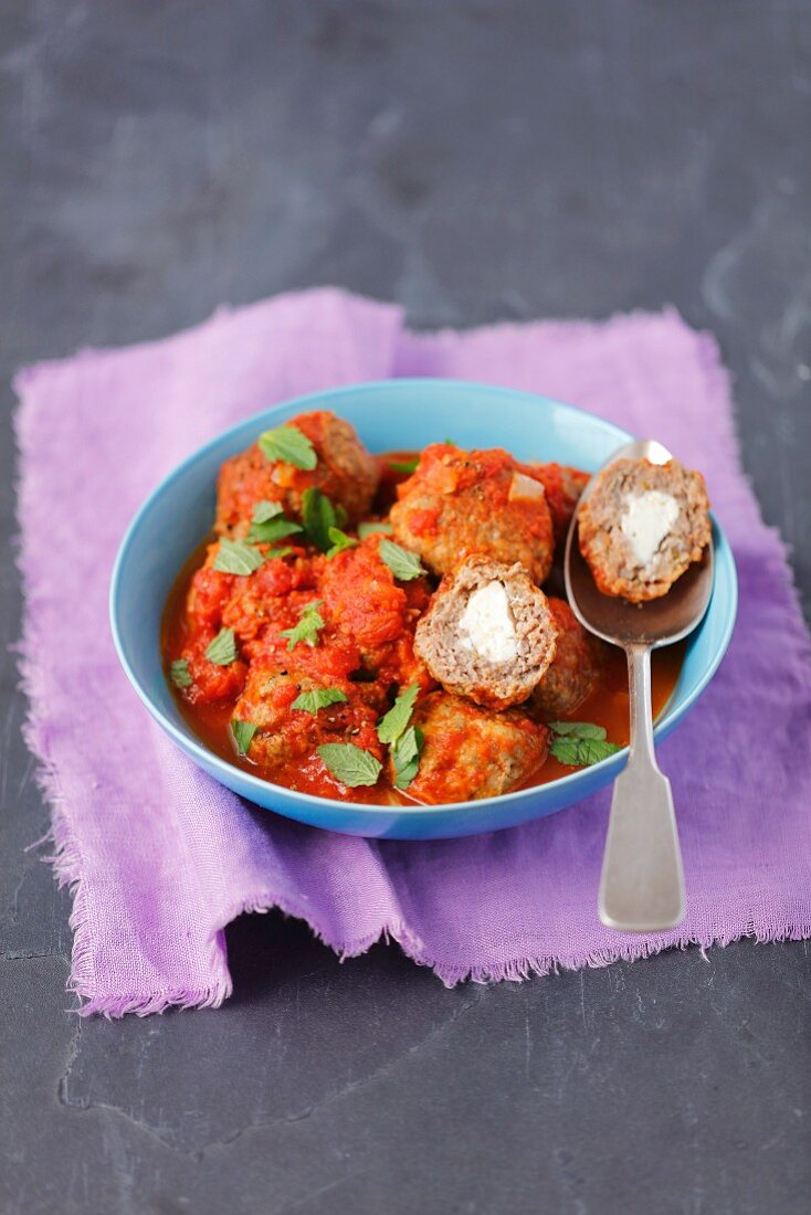 Pork and beef meatballs with feta in tomato sauce