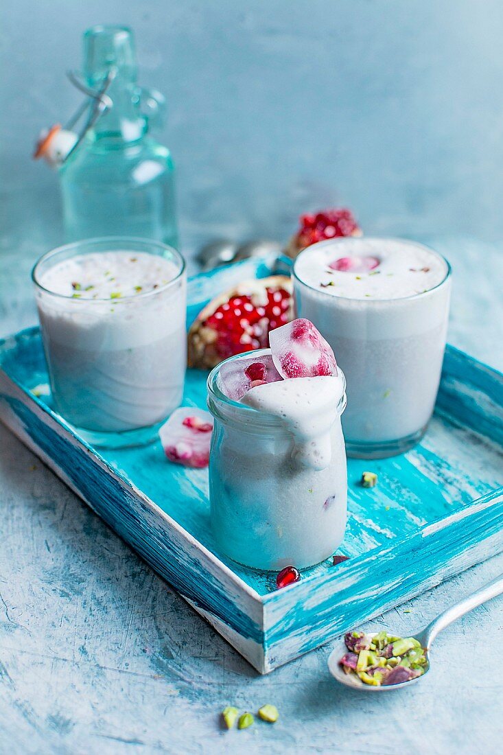 Smoothies with pomegranate seeds and pistachios
