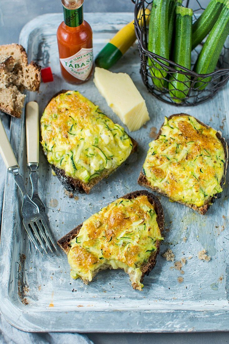 Zucchini toasts with cheddar cheese and Tabasco sauce