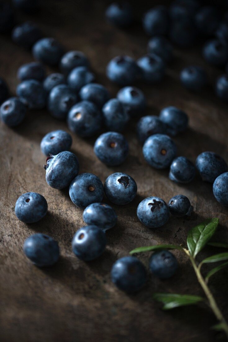 Lots of blueberries on a wooden background