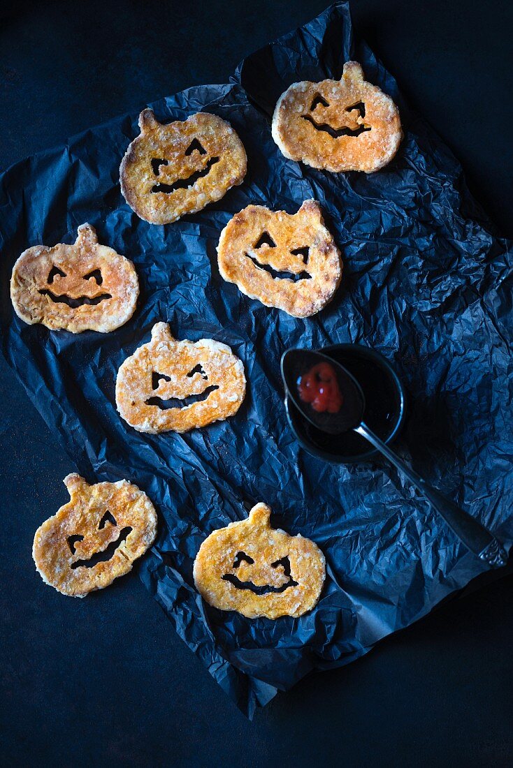 Sweet potato pumpkins with black and red ketchup for Halloween