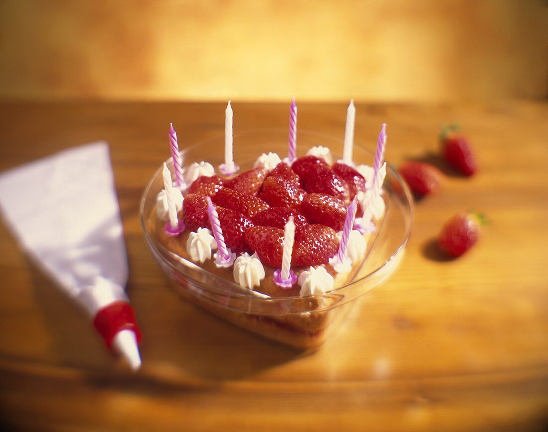 Sponge heart with strawberries as birthday cake