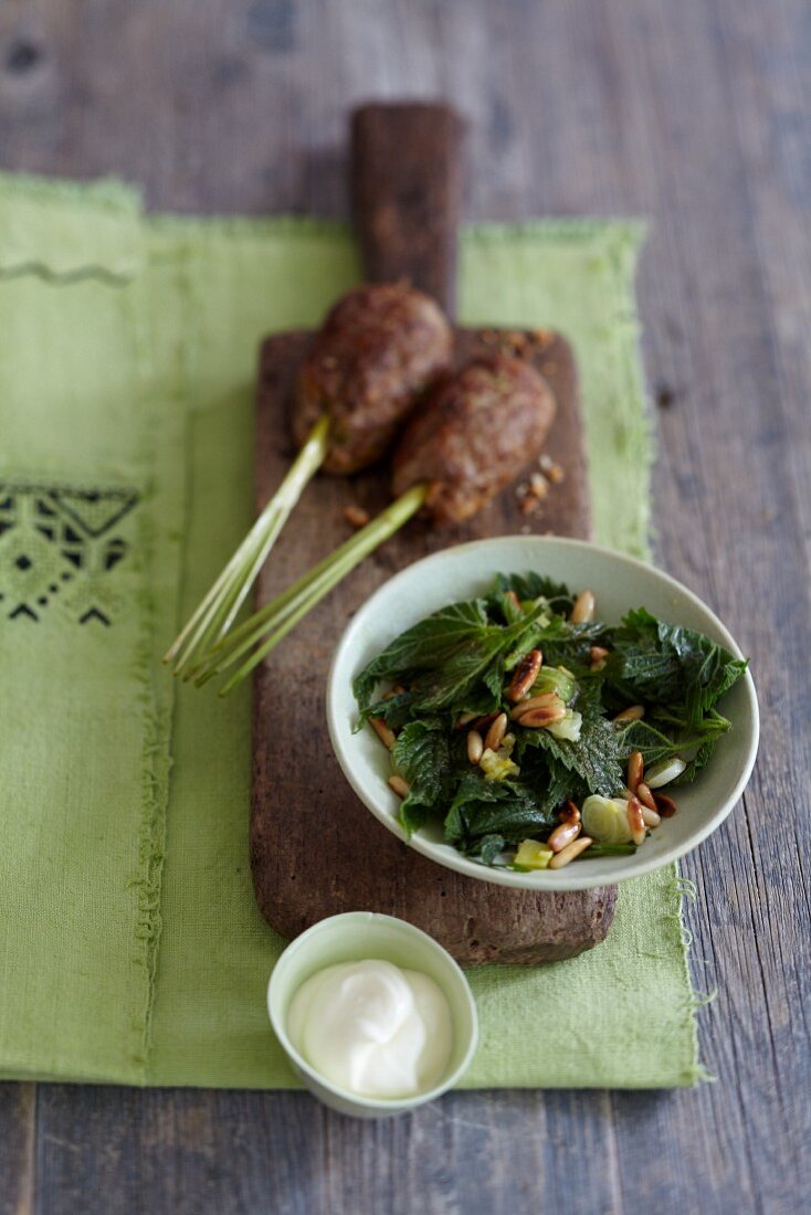Stinging nettle spinach with pine nuts served with kofta meatballs