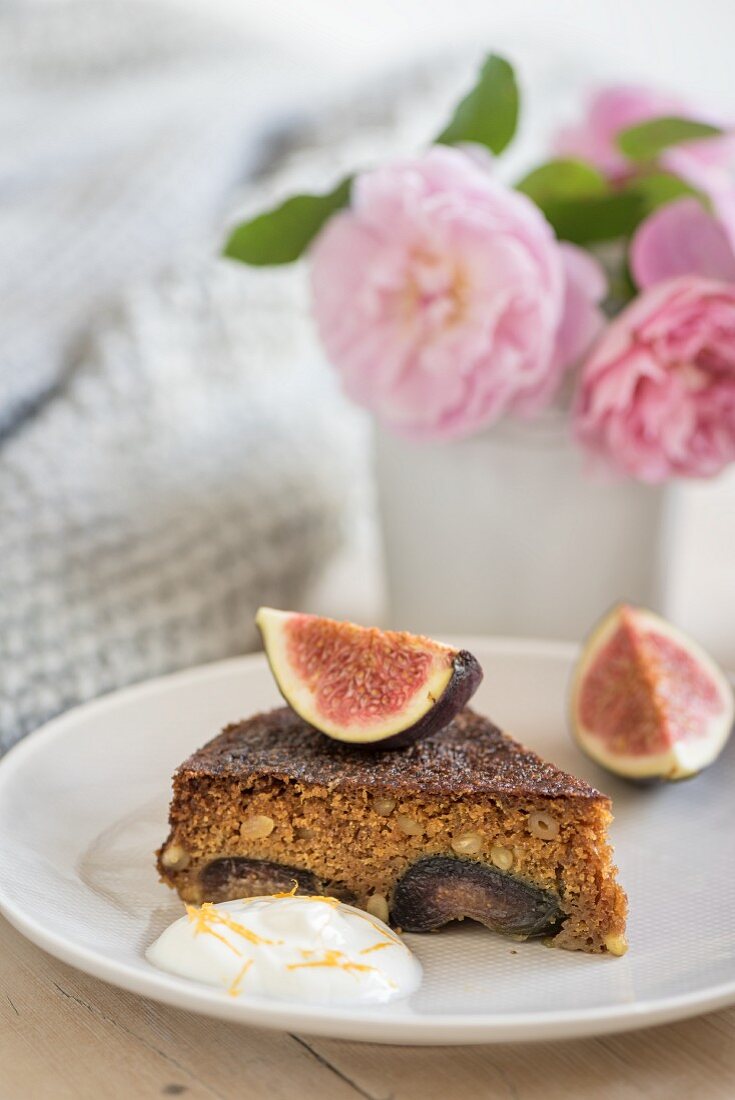 A slice of turmeric and orange cake with fig