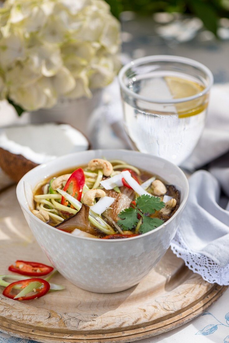Noodle soup with mushrooms, chilies and cashew nuts (Asia)