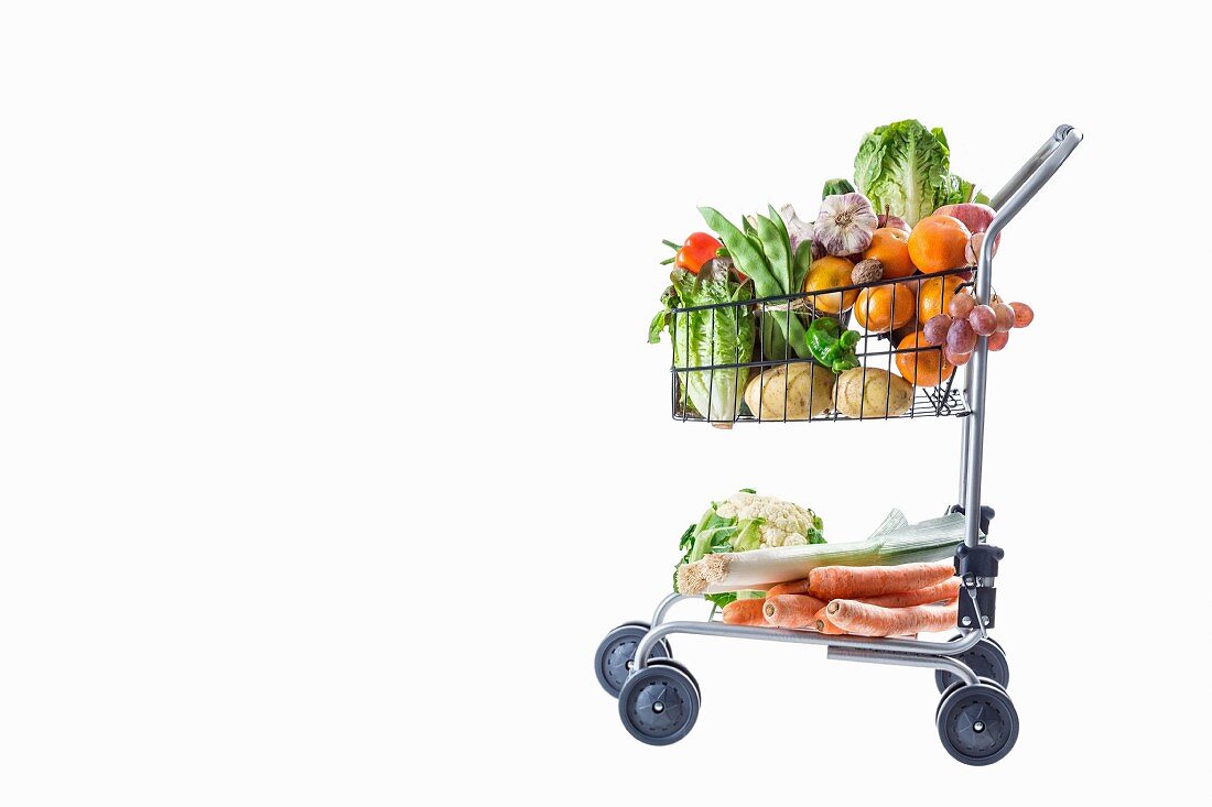 A shopping trolley full of fresh fruit and vegetables