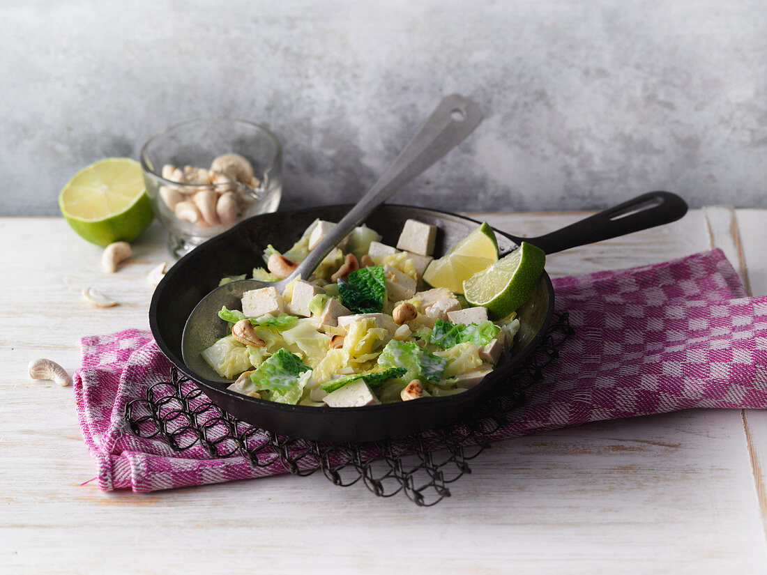Savoy cabbage and tofu with coconut milk and cashew nuts