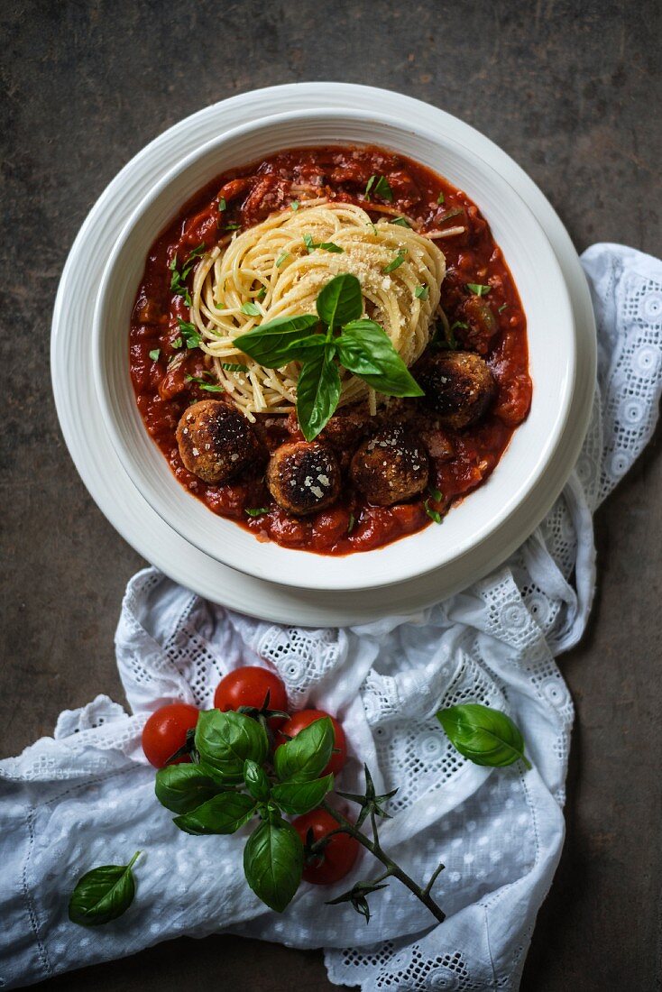 Spaghetti with zucchini and tomato sauce and vegan rissoles