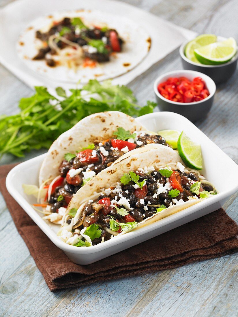 Black bean tacos with tomato, coriander and lime
