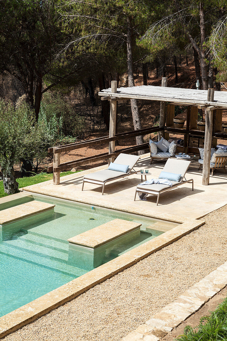 View down onto swimming pool and sun loungers