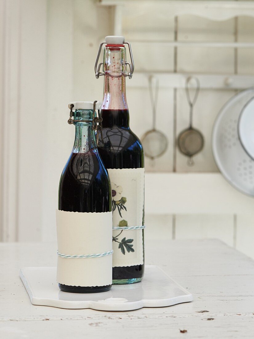 Homemade blueberry syrup in bottles