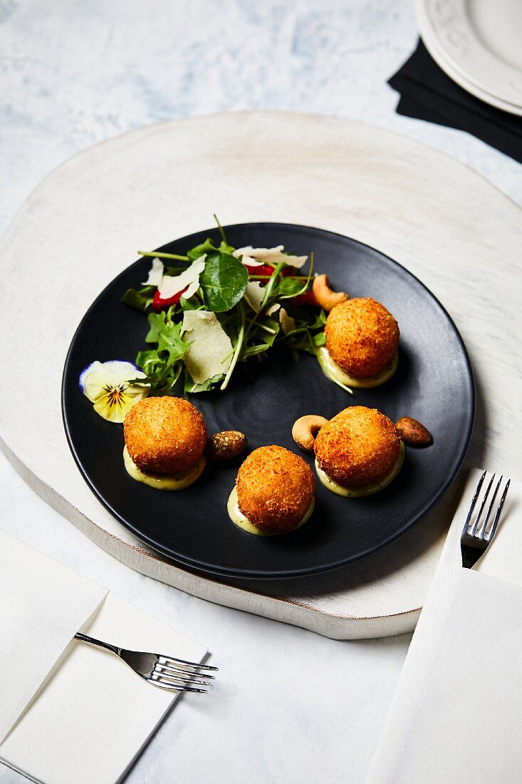 Arancini with lettuce and parmesan