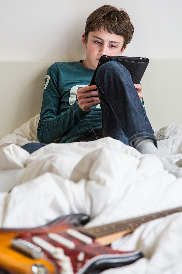 Teenage boy using a digital tablet