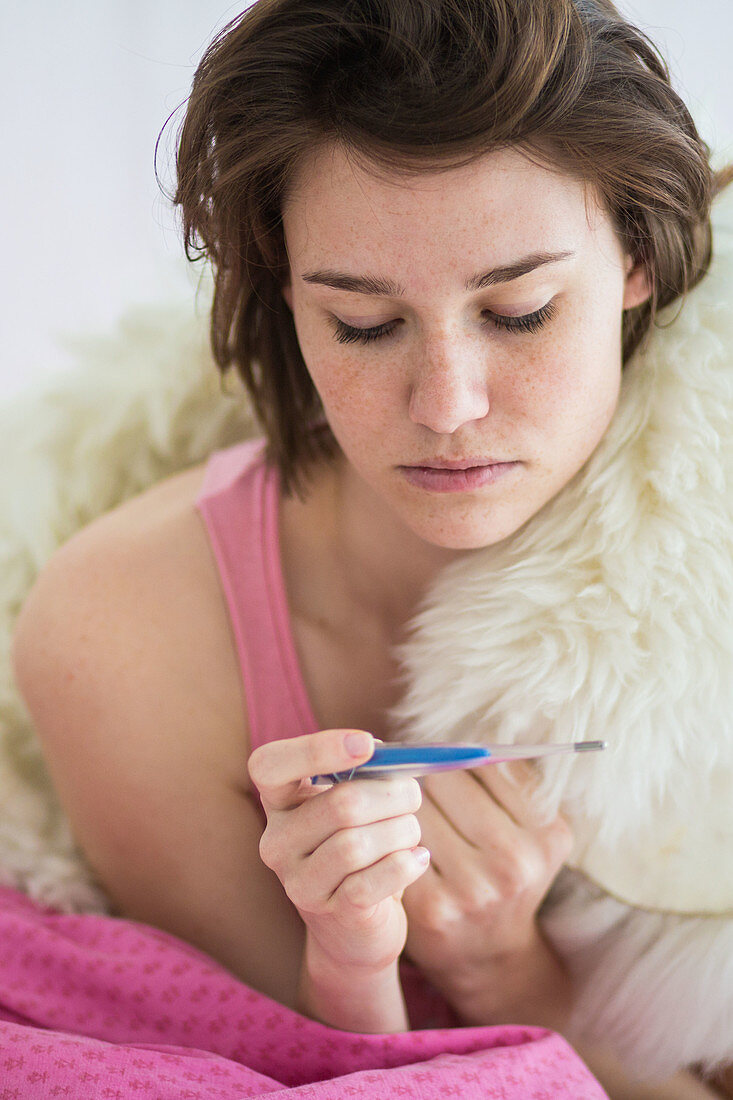 Woman checking her temperature