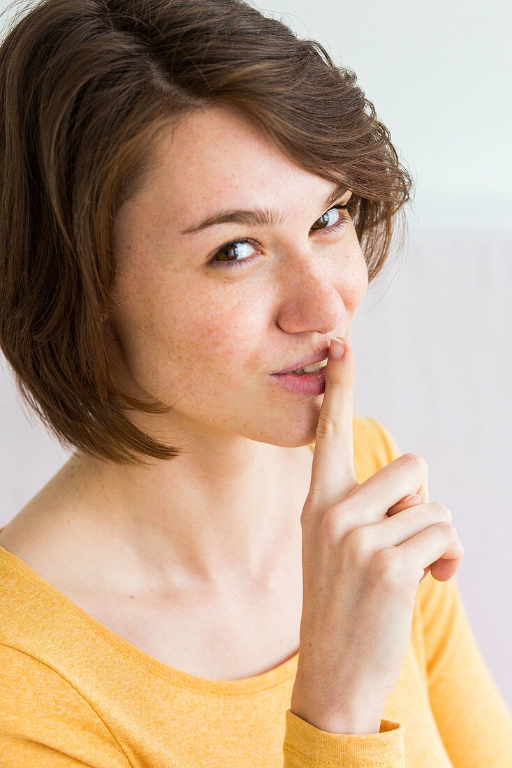 Woman signing to be silent