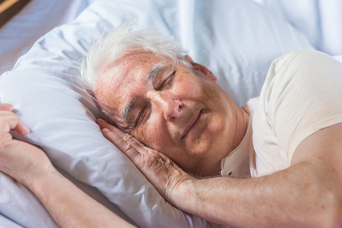 Man napping in bed