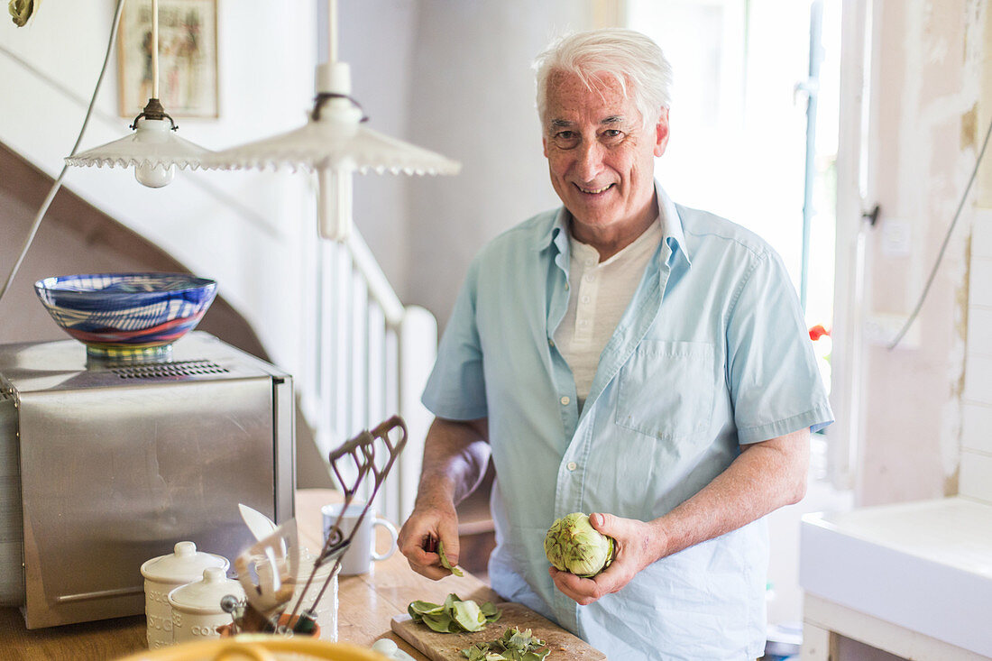 Man preparing artichokes