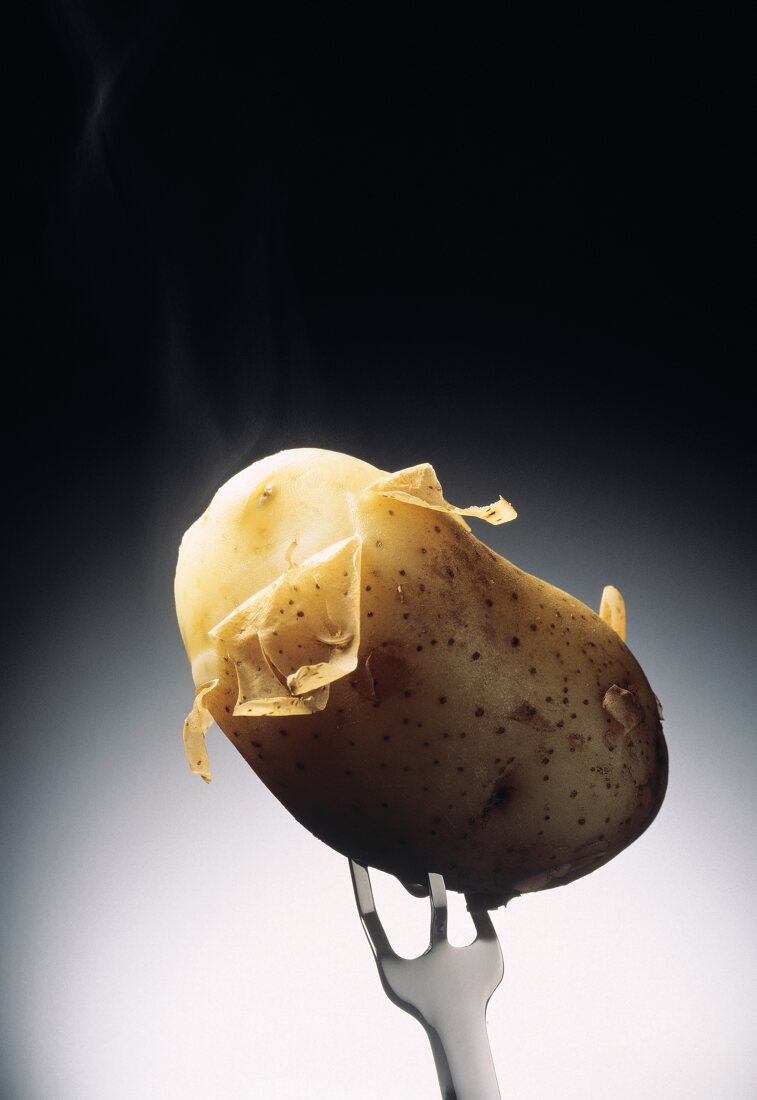 A Potato in its Skin on a Fork