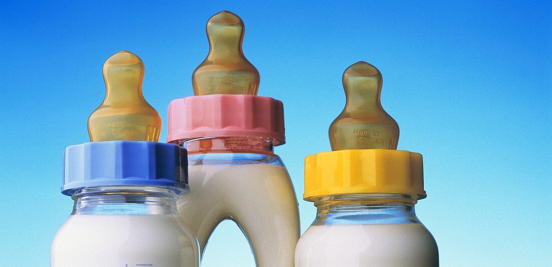 Three Baby Bottles Full of Milk